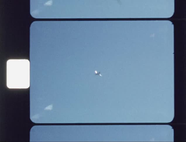 An aircraft is flying past the clear sky