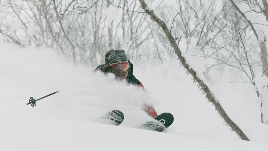 A skier turns in deep snow