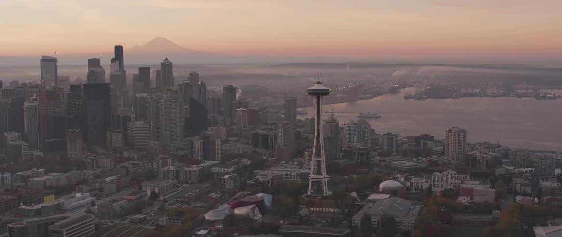 Seattle's space needle towers above the city at dusk