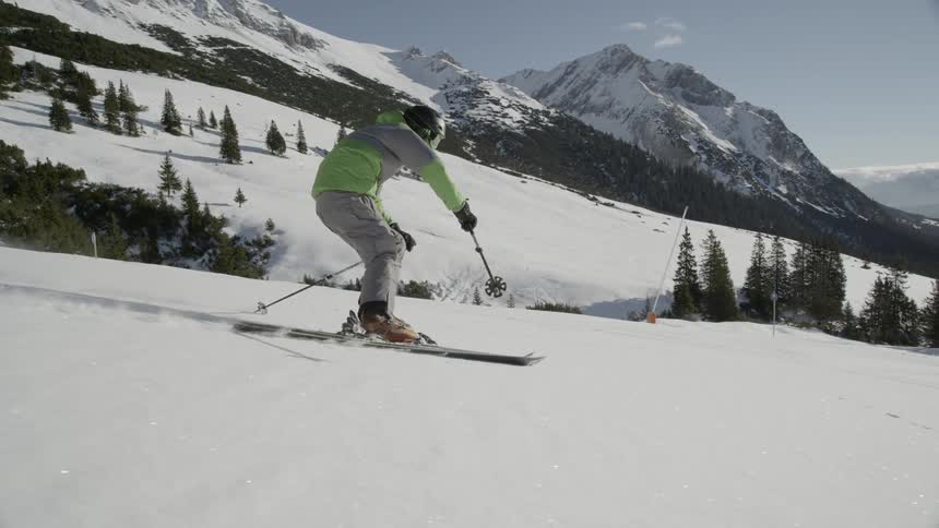 The person skiing down the slope