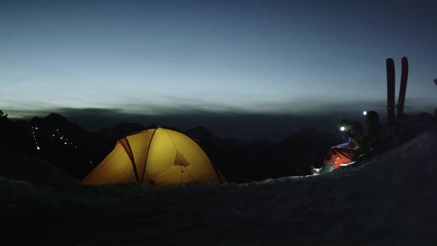 Campers light up their tents with headlamps