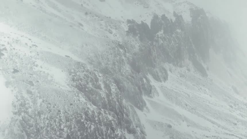 Snow covers the mountain landscape