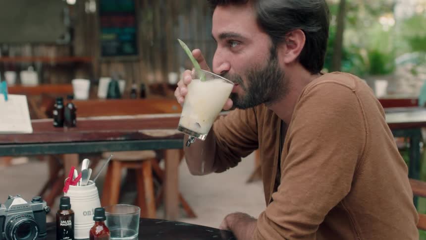 Man and woman touch glasses and take a drink