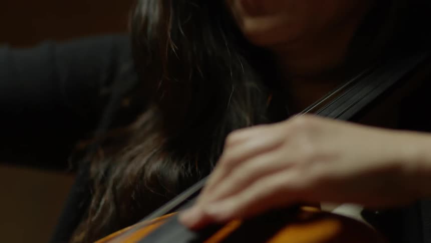 A woman plays a cello