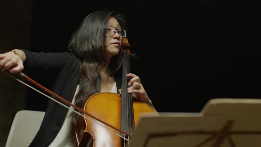 A woman plays a cello