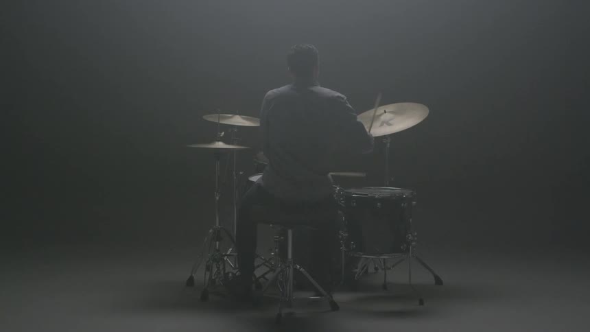 A man plays the drums