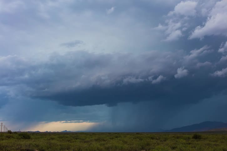 The sky is full of large looming storm clouds