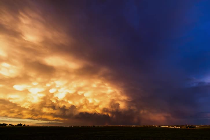 Storm clouds darken and move across the sky
