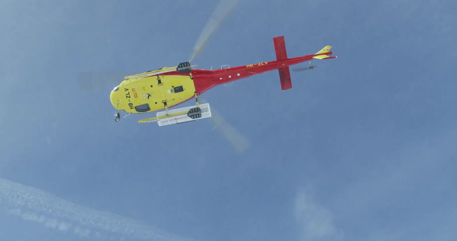 Helicopter ascending as seen almost directly from below on a clear day