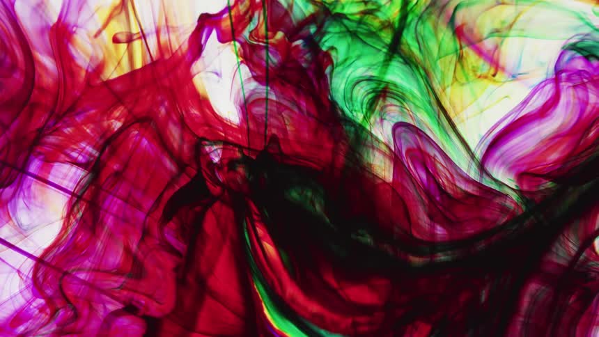 Multi-colored liquid rotates and swirls together