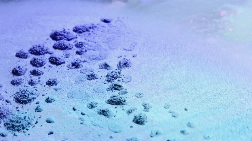 Powder vibrates and moves in a cymatic pattern