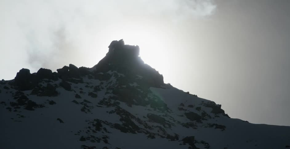 Clouds pass above the mountains