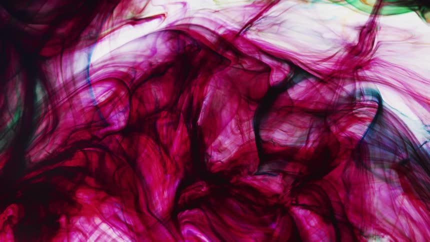 Pink and red colors swirl in the water