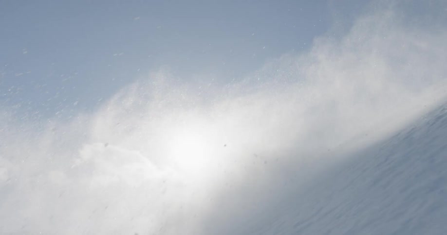 A skier makes a sharp turn on the slope