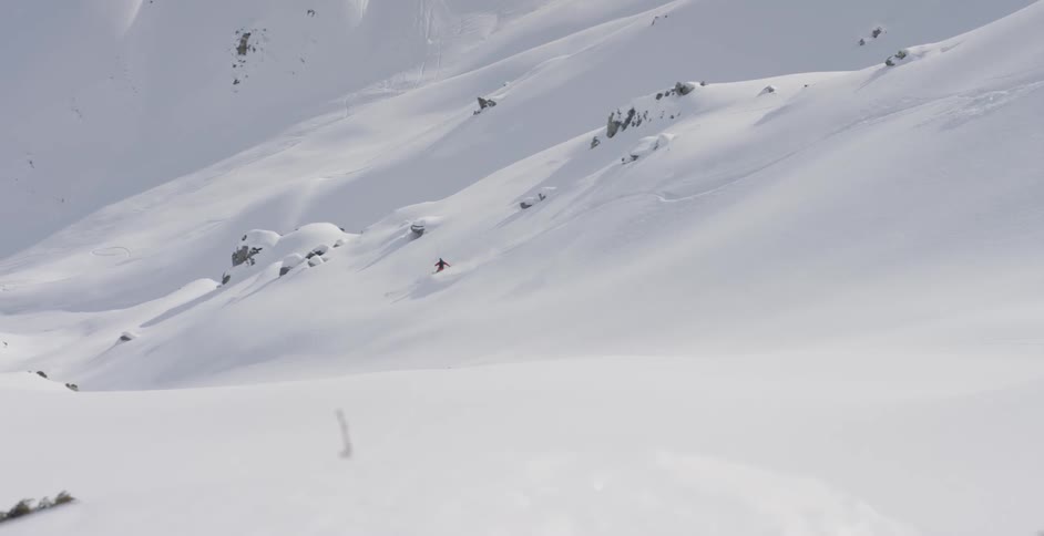 Man skiing down a long mountains side