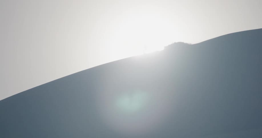A skier descends down the slope