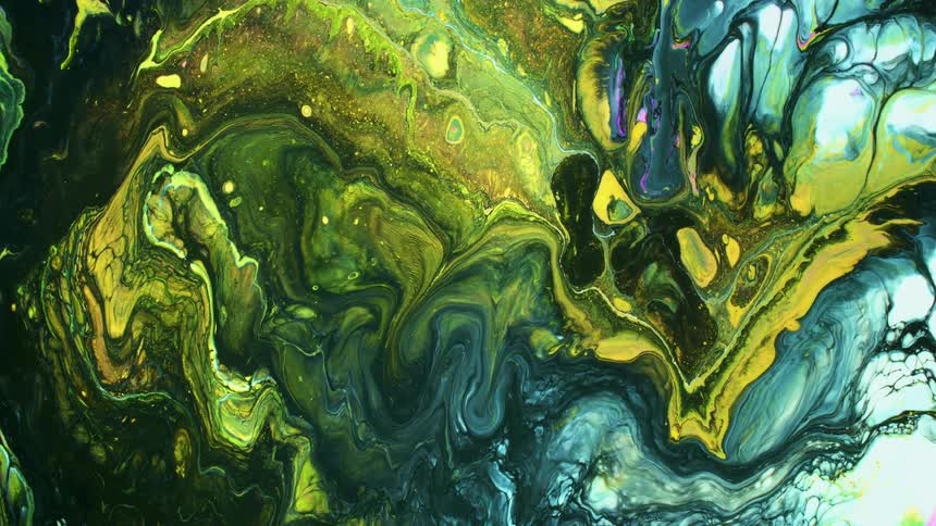 Multicolored liquid droops and falls downward