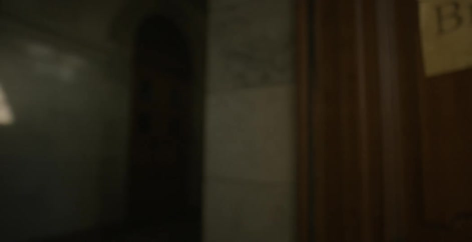 A person pulls the handle and enters the door