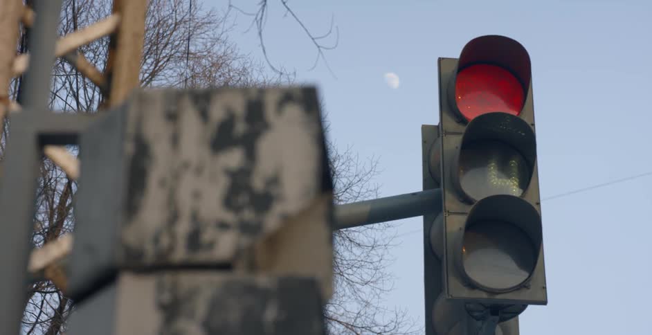 A street light directs traffic on the street