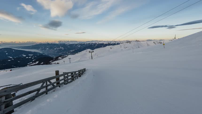 Time-lapse of a ski lift area as the clouds pass over it