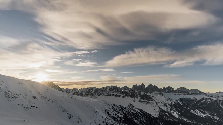 Clouds pass above the mountains