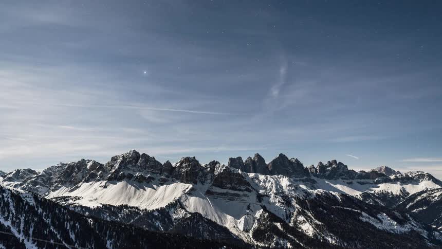 Clouds pass above the mountains