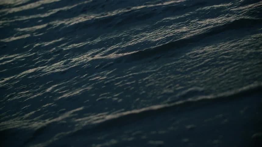 The ocean tide flows towards the shore