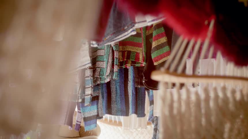 Clothes hang in a marketplace