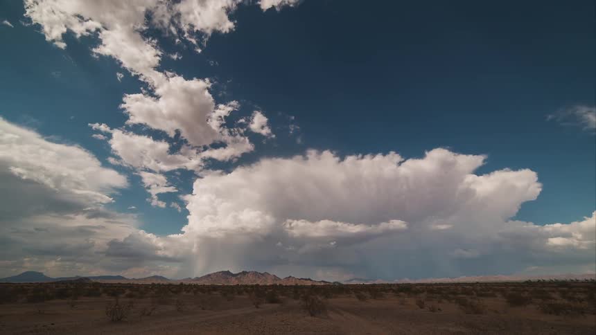 Clouds move over a wide plain
