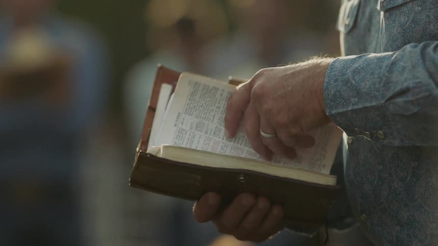 A man turns the pages of a book