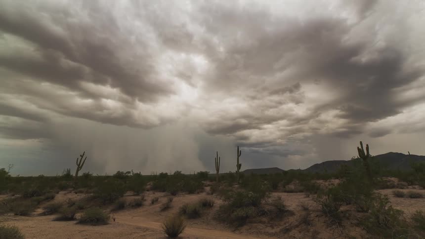 Clouds rolling over a desert