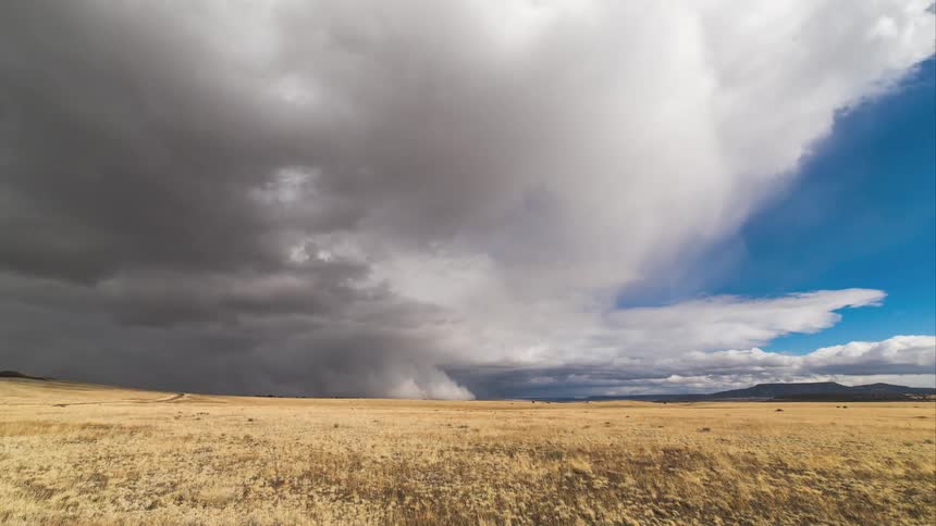 Time lapse of a field as clouds move overhead