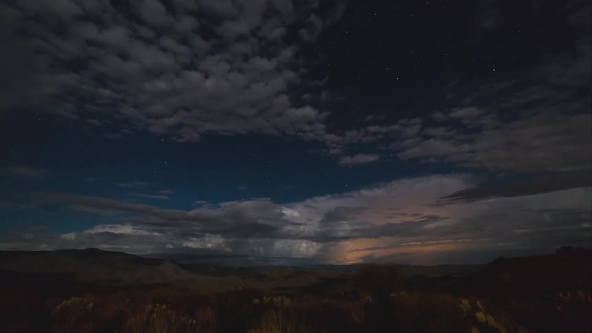 A storm is shown in timelapse in the desert