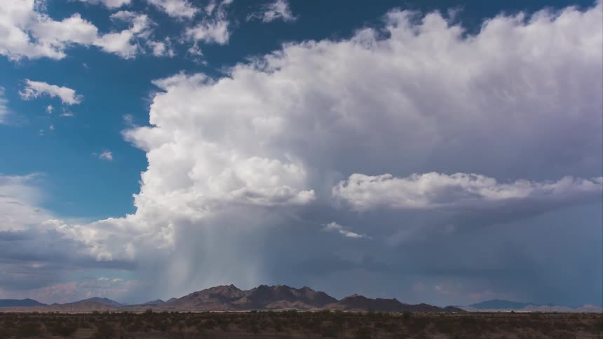 Clouds float over a desert
