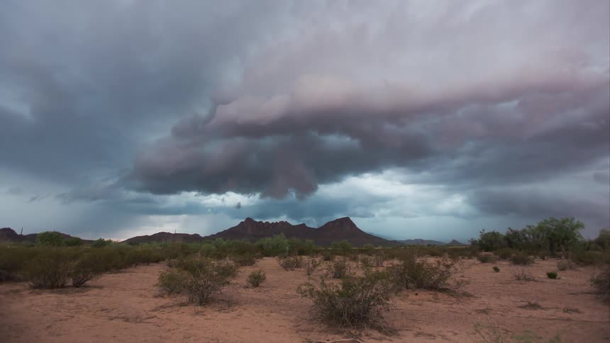 Clouds float over a desert