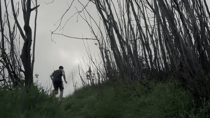 A man jogs up a hill