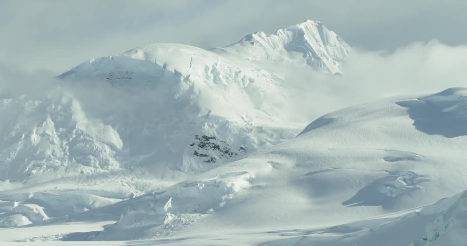Snow and ice cover the mountains