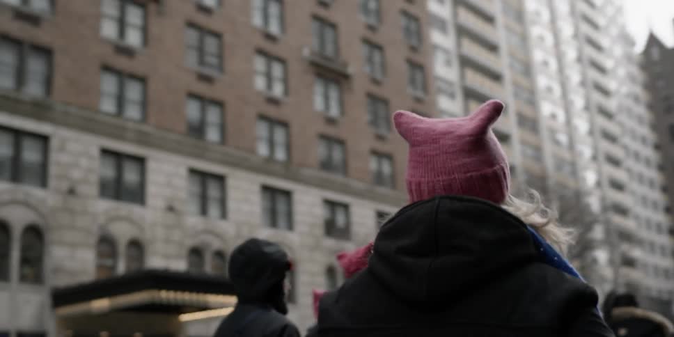 Protesters march on a city street