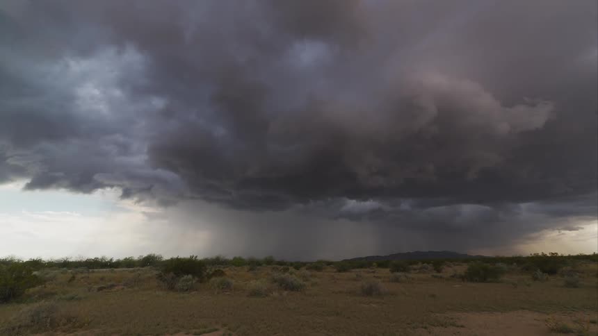 Time lapse of a violent storm moving over a rural area