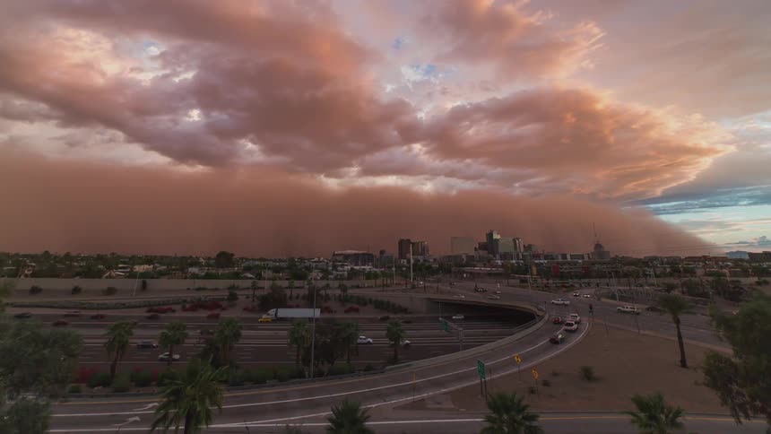 Dust storm sweeps over a city