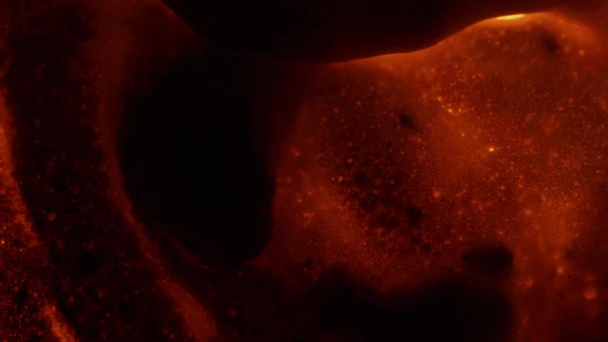 Orange surface darkens and expands as it cooks