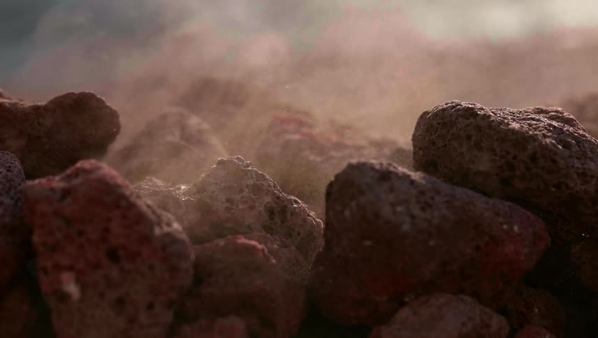 Rocks and dirt fall into a pile