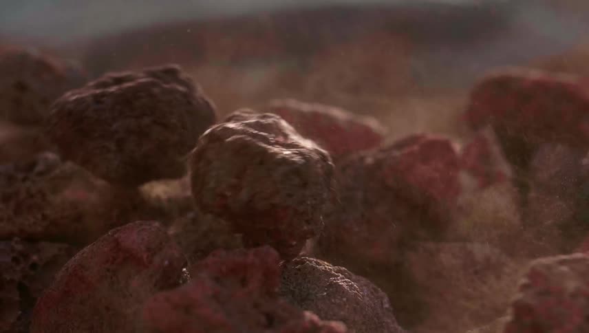 Rocks are dropped into a pile