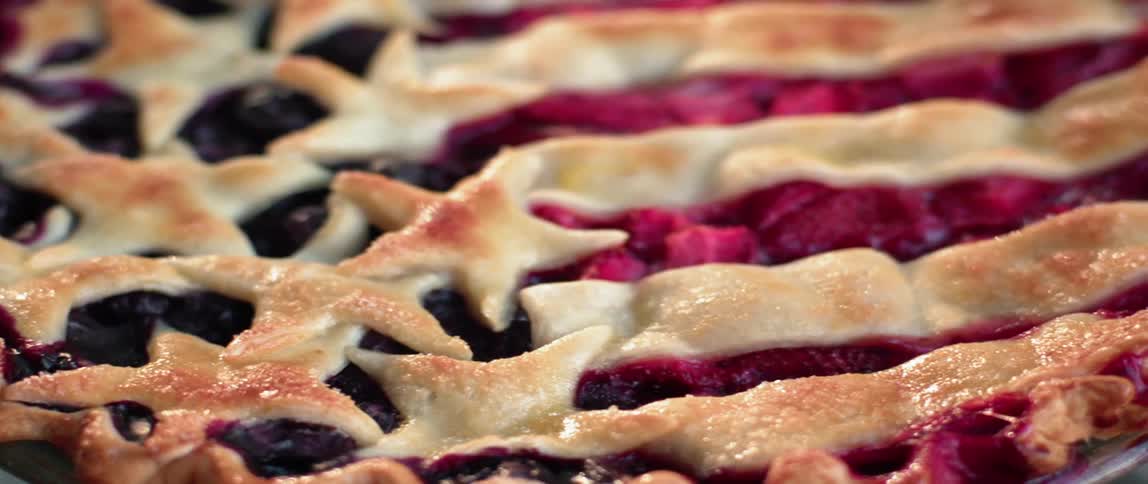 A berry pie is decorated like an american flag