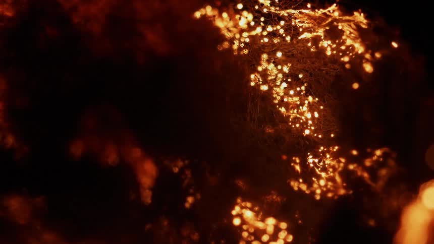 A fire burns through fibers
