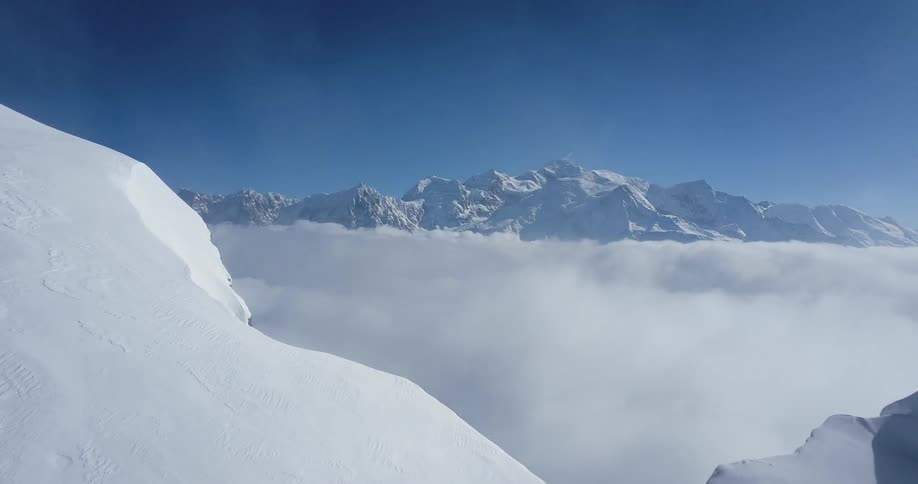 Snow covered mountains under a blue sky