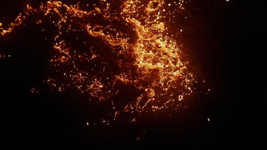 The tinder blazes and burns in the dark