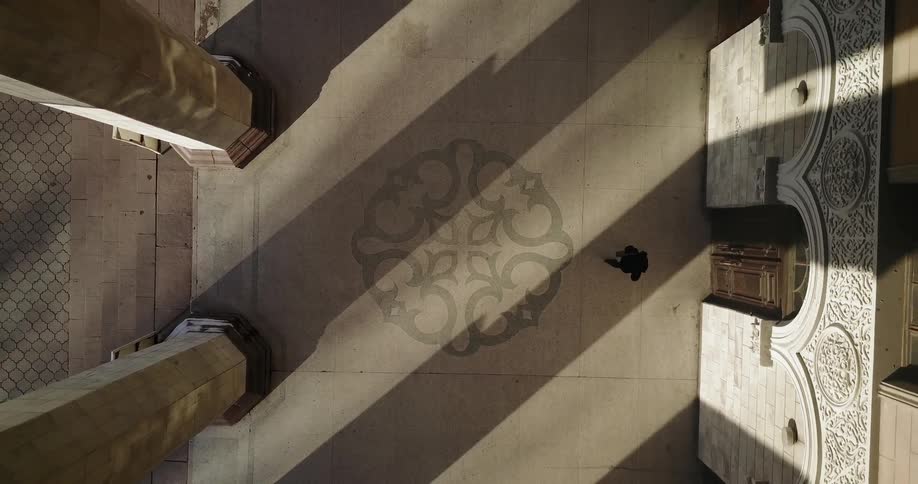 A woman approaches and enters into a building