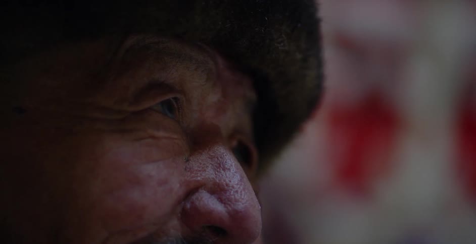 Elderly man looking forward as seen extremely close up