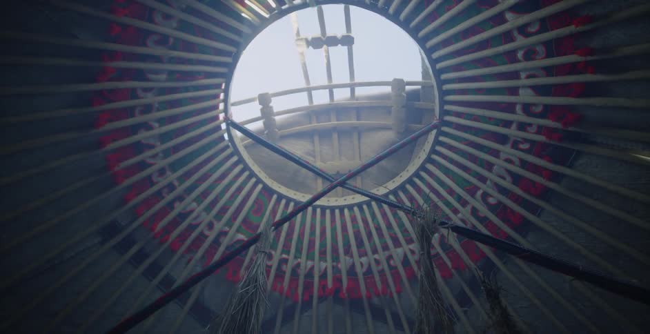 Grass hangs from a yurt ceiling